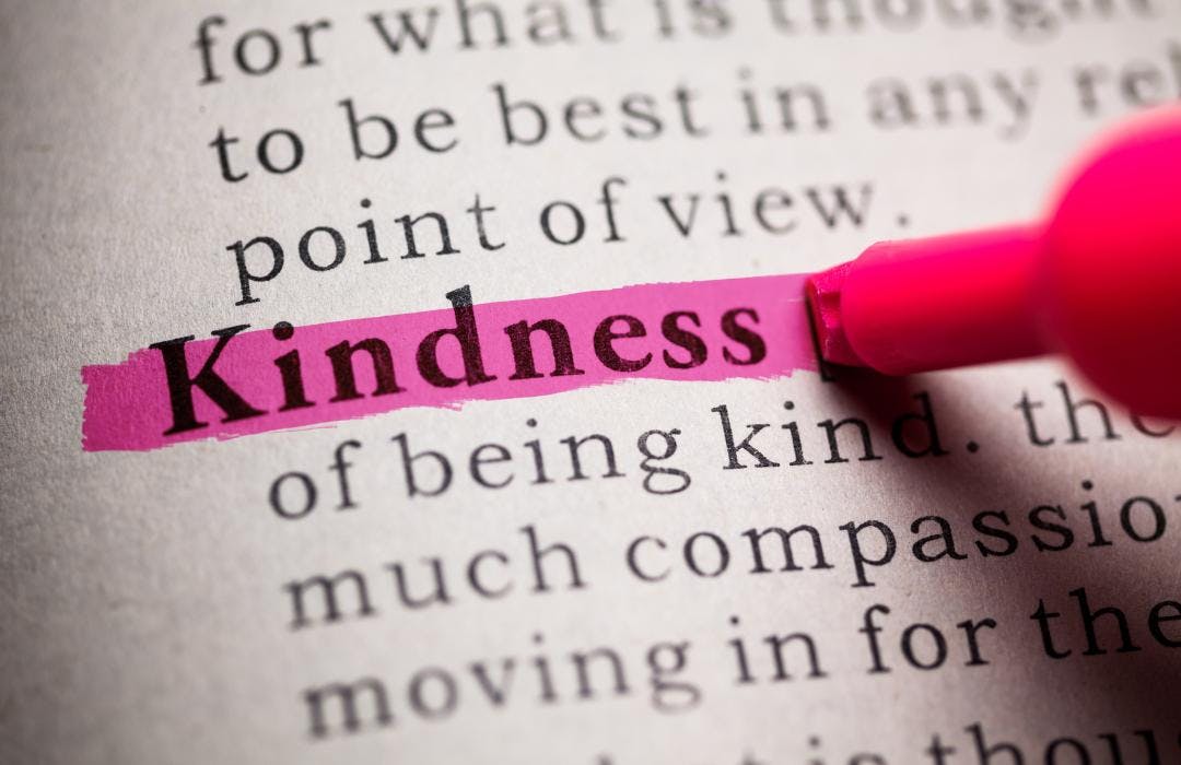 Text in a book, with the word "Kindness" highlighted