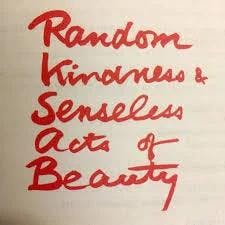 The words "Random, Kindness & Senseless Acts of Beauty" written on paper, in cursive